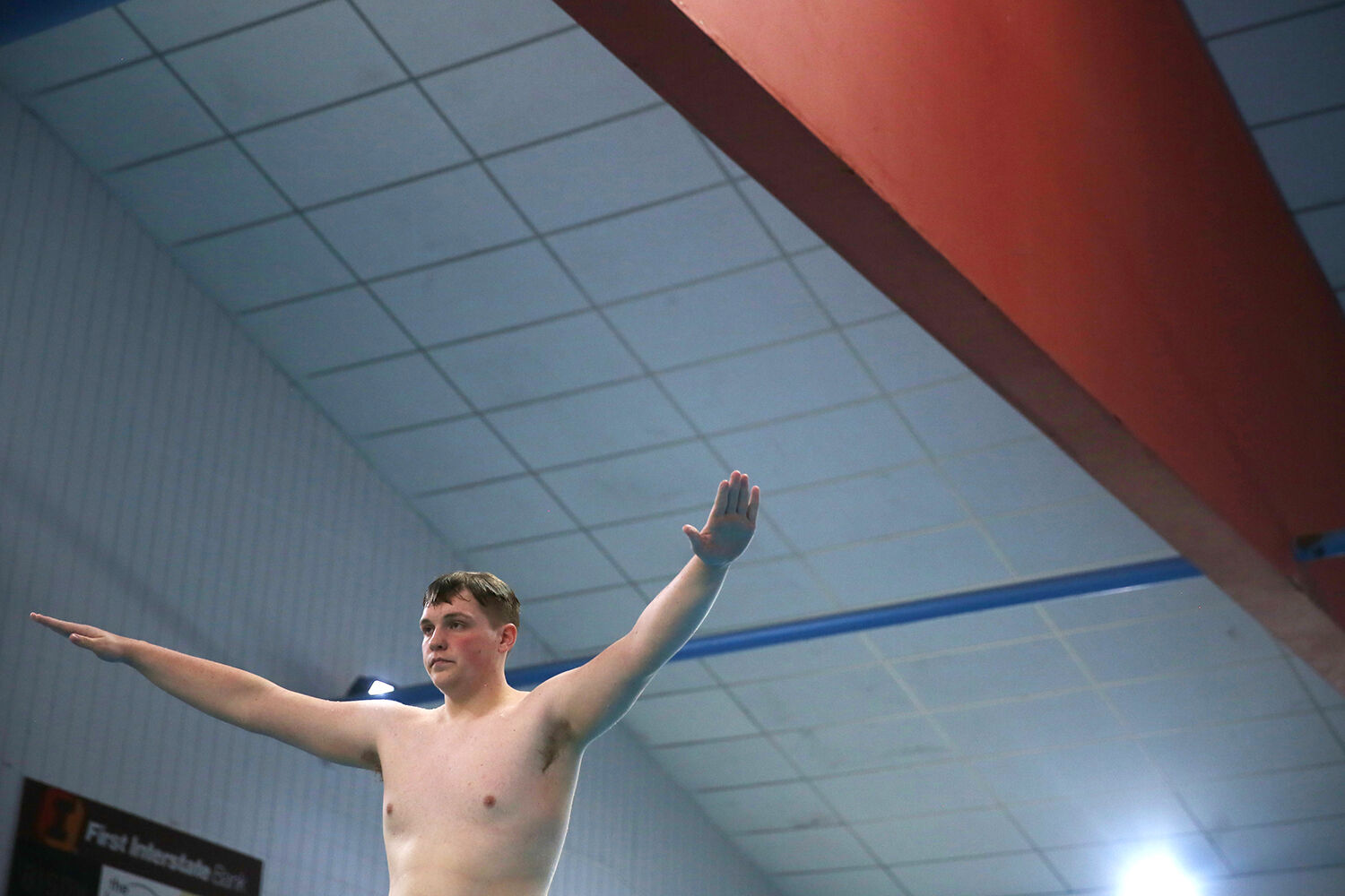 Eli Barker balances on the end of the diving board